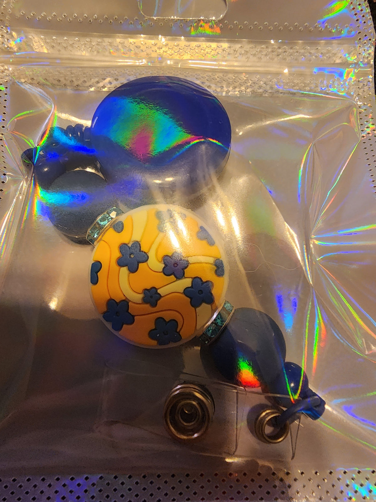 Yellow and blue badge reel