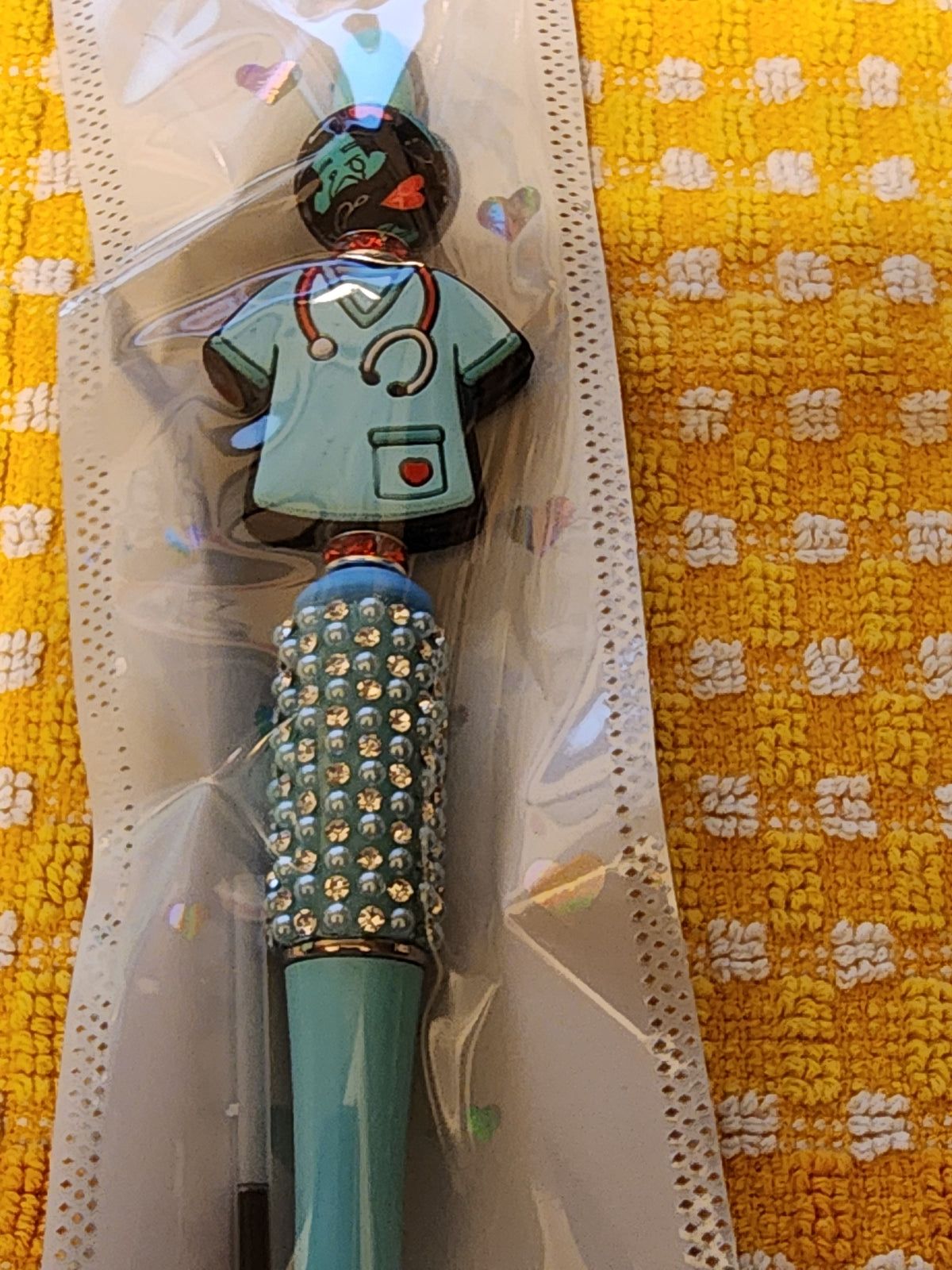Light blue sparkly scrub top pen