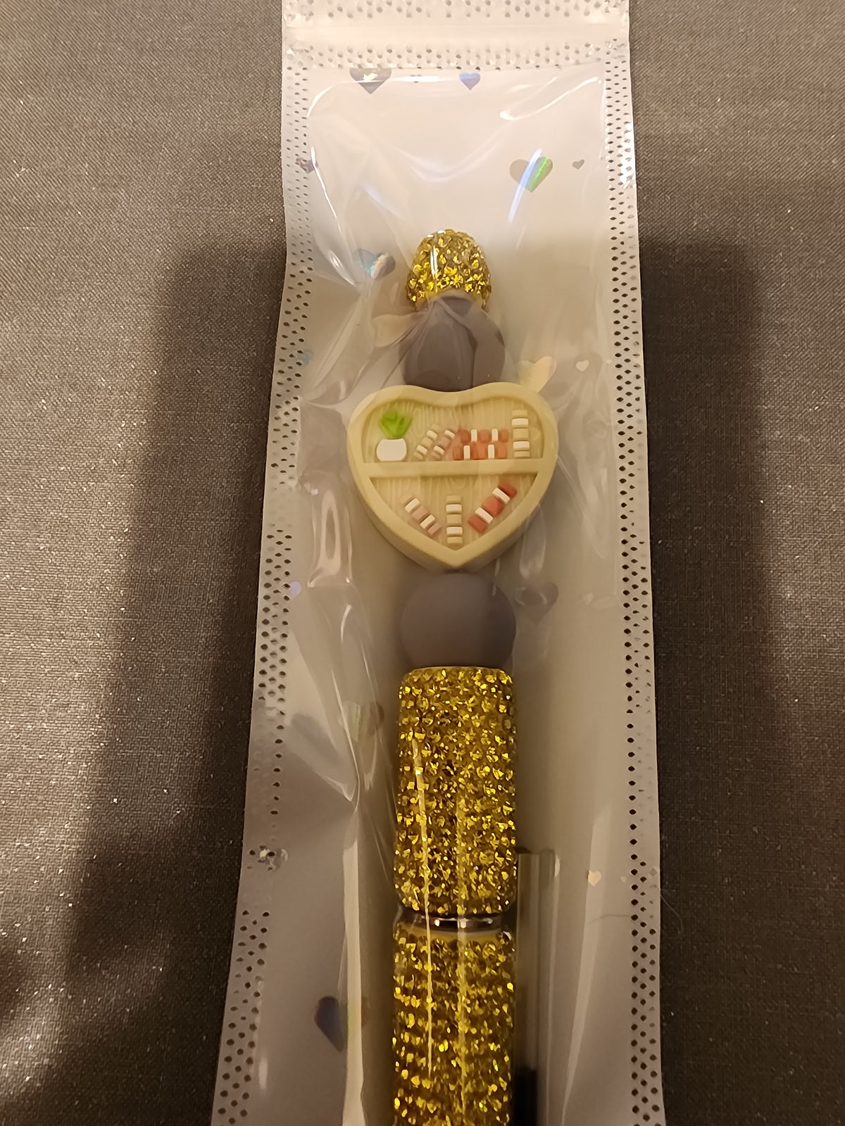 Yellow rhinestone pen with bookcase