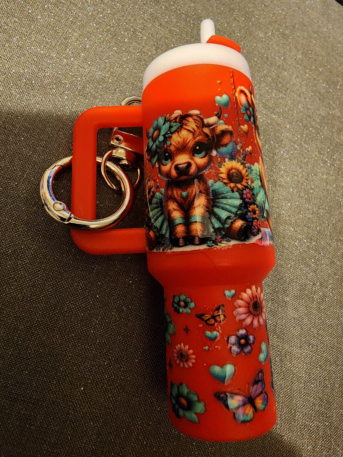 Red highland cow wearing a tutu chapstick holder