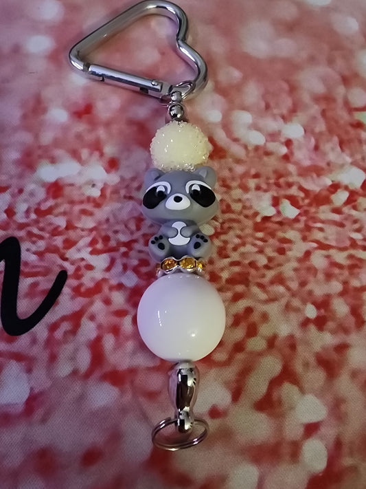 Yellow and white racoon keychain