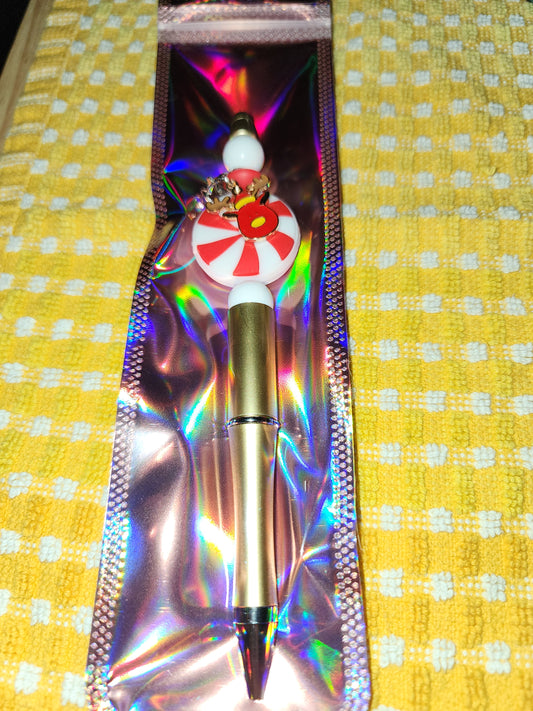Spiral holiday candy with reindeer charm pen