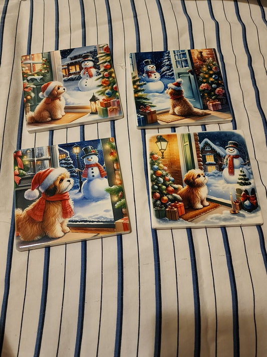 Christmas doggies looking out of snowman ceramic coasters