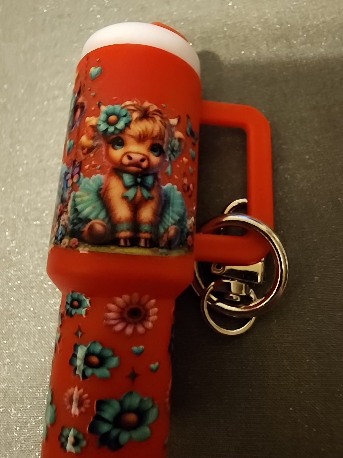 Red highland cow wearing a tutu chapstick holder