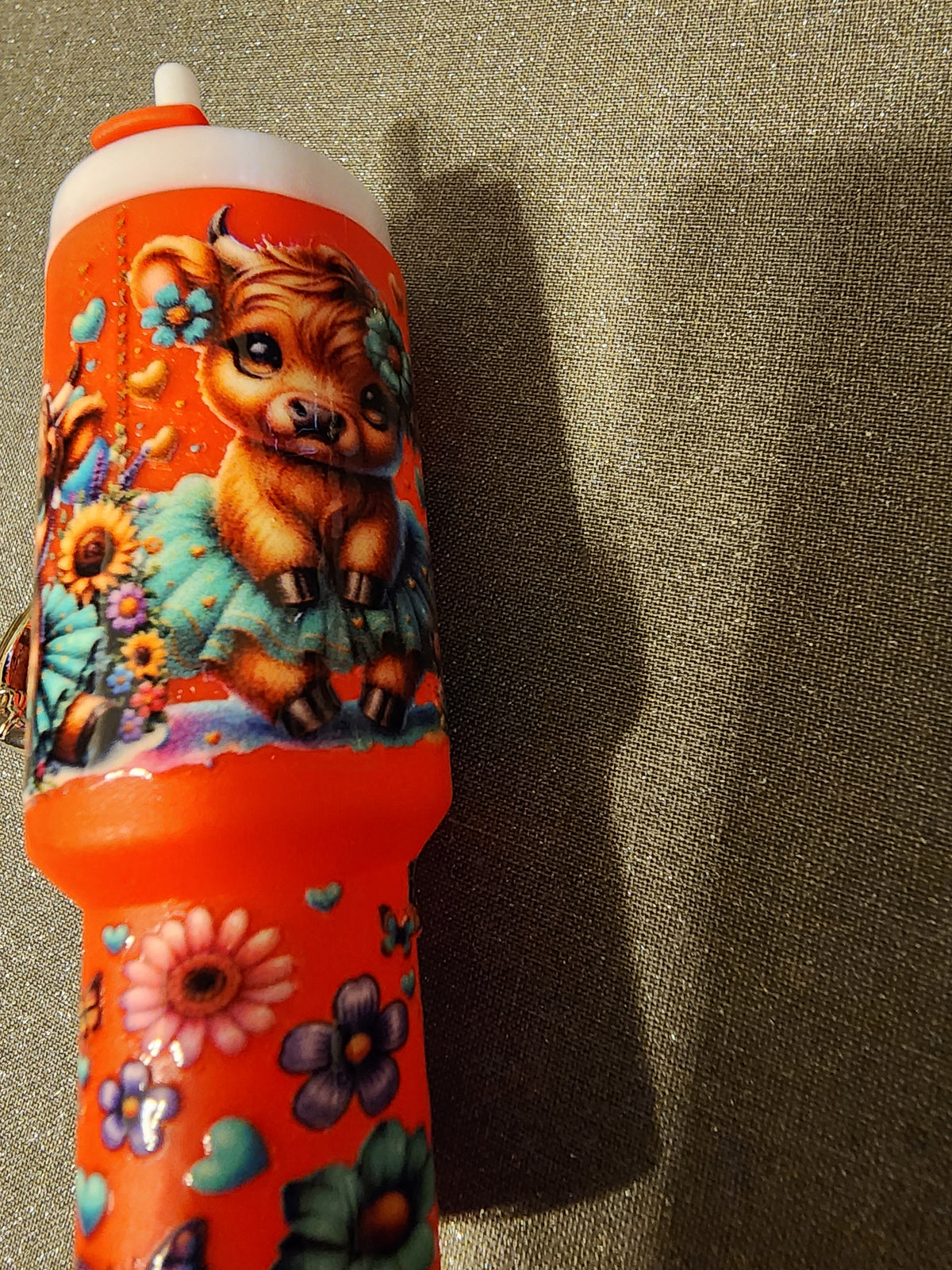 Red highland cow wearing a tutu chapstick holder