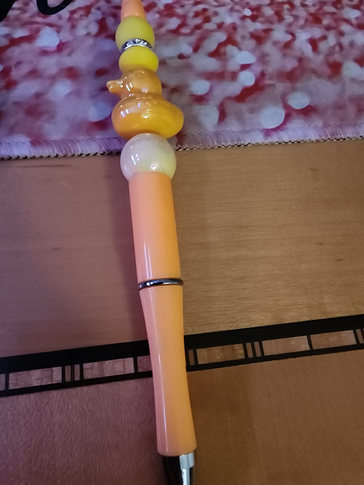 Orange rubber ducky pen