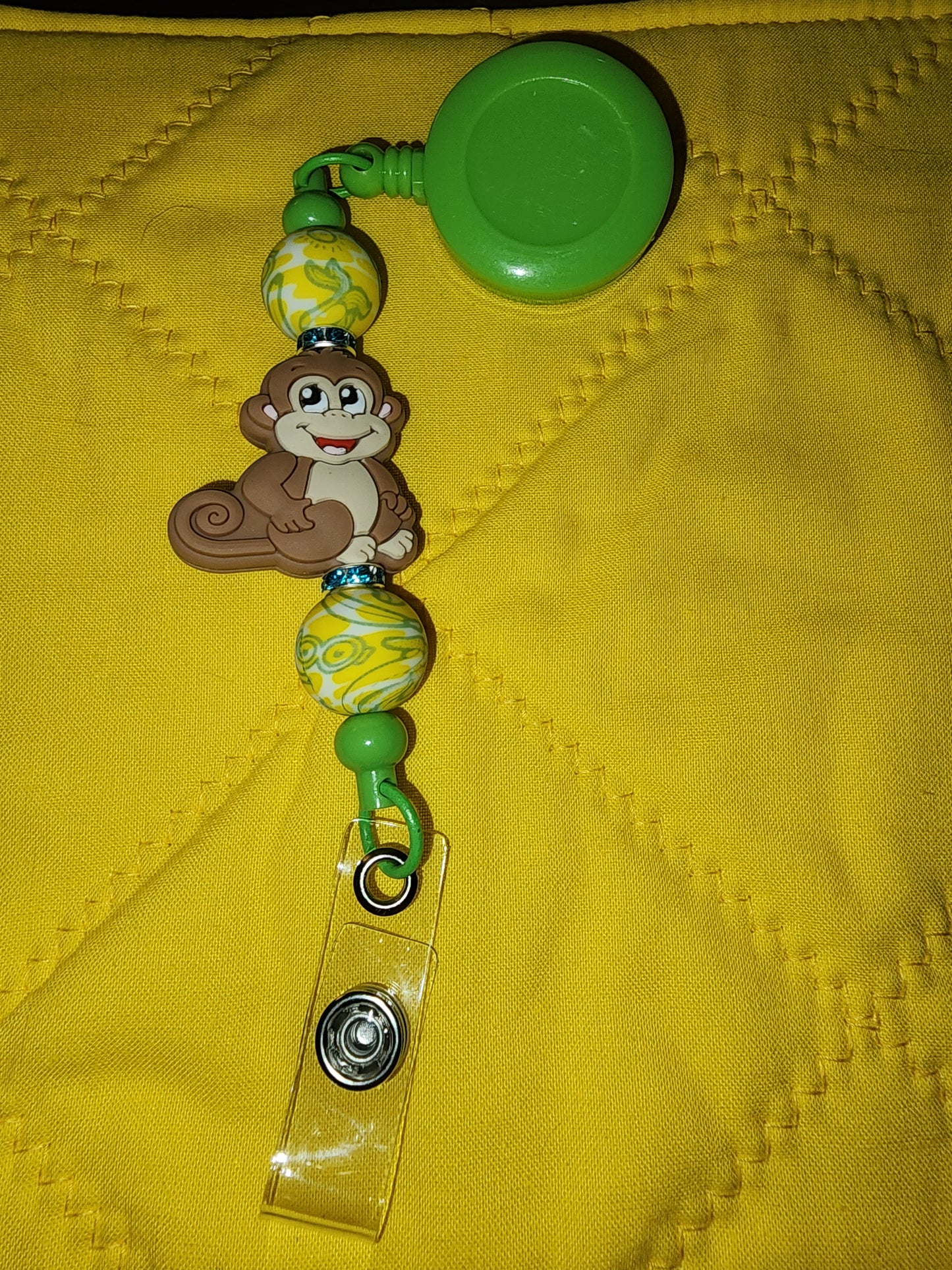 Monkey and banana badge reel