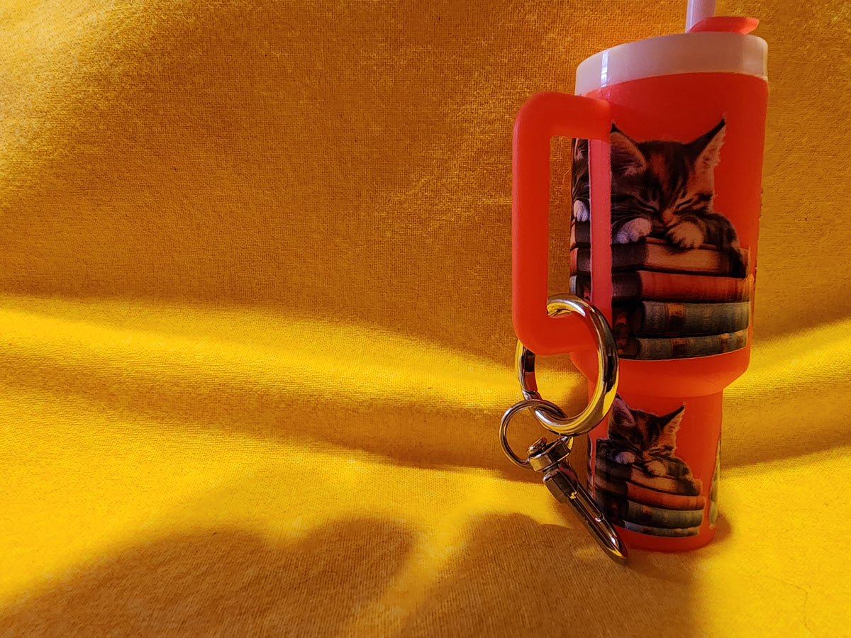 Sleeping kittens on books chapstick holder
