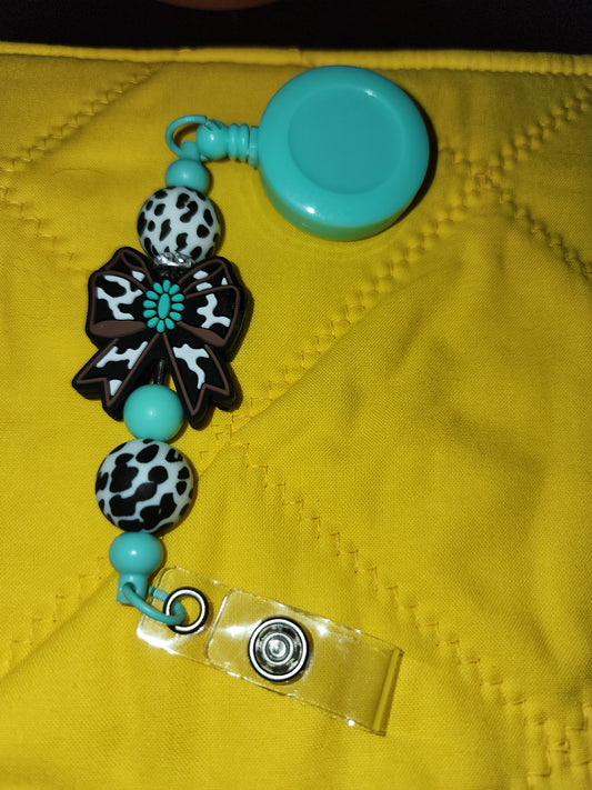 Cow print with ribbon badge reel