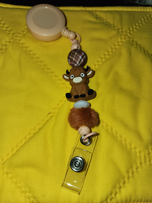 Brown Highland cow badge reel