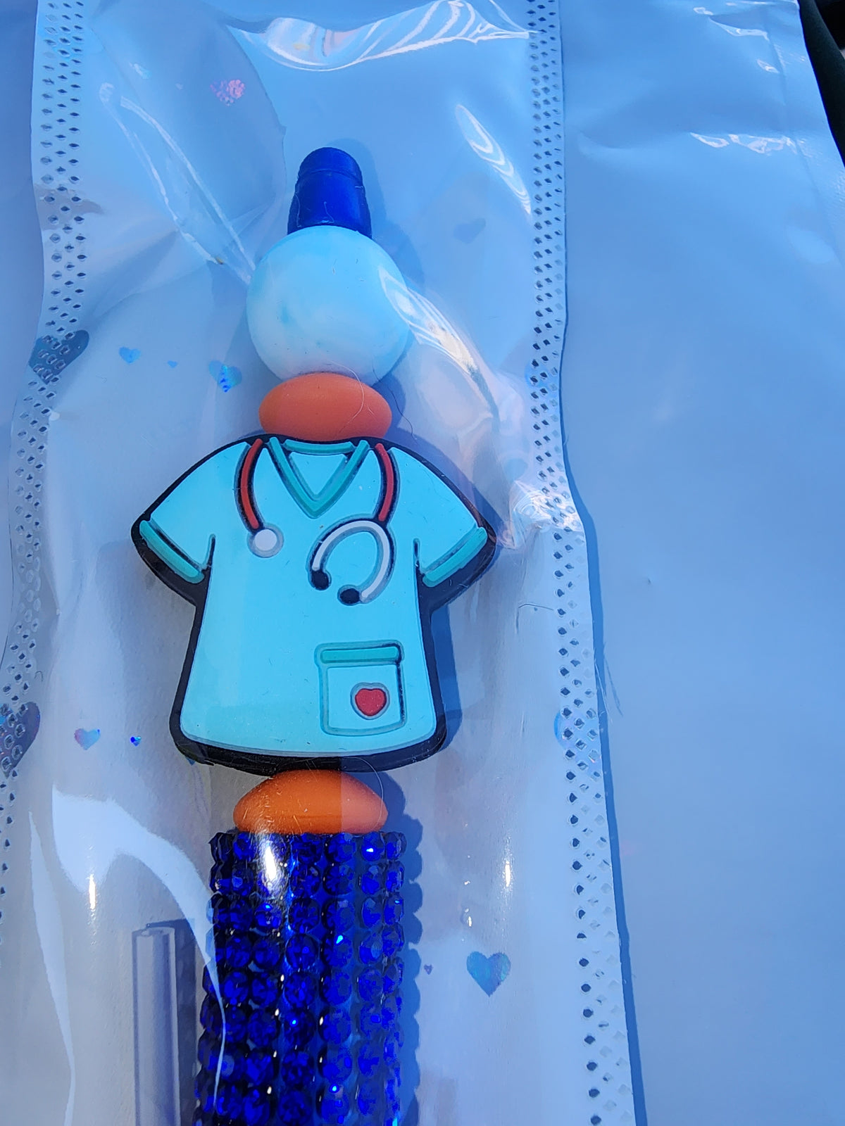 Blue sparkly scrub top pen