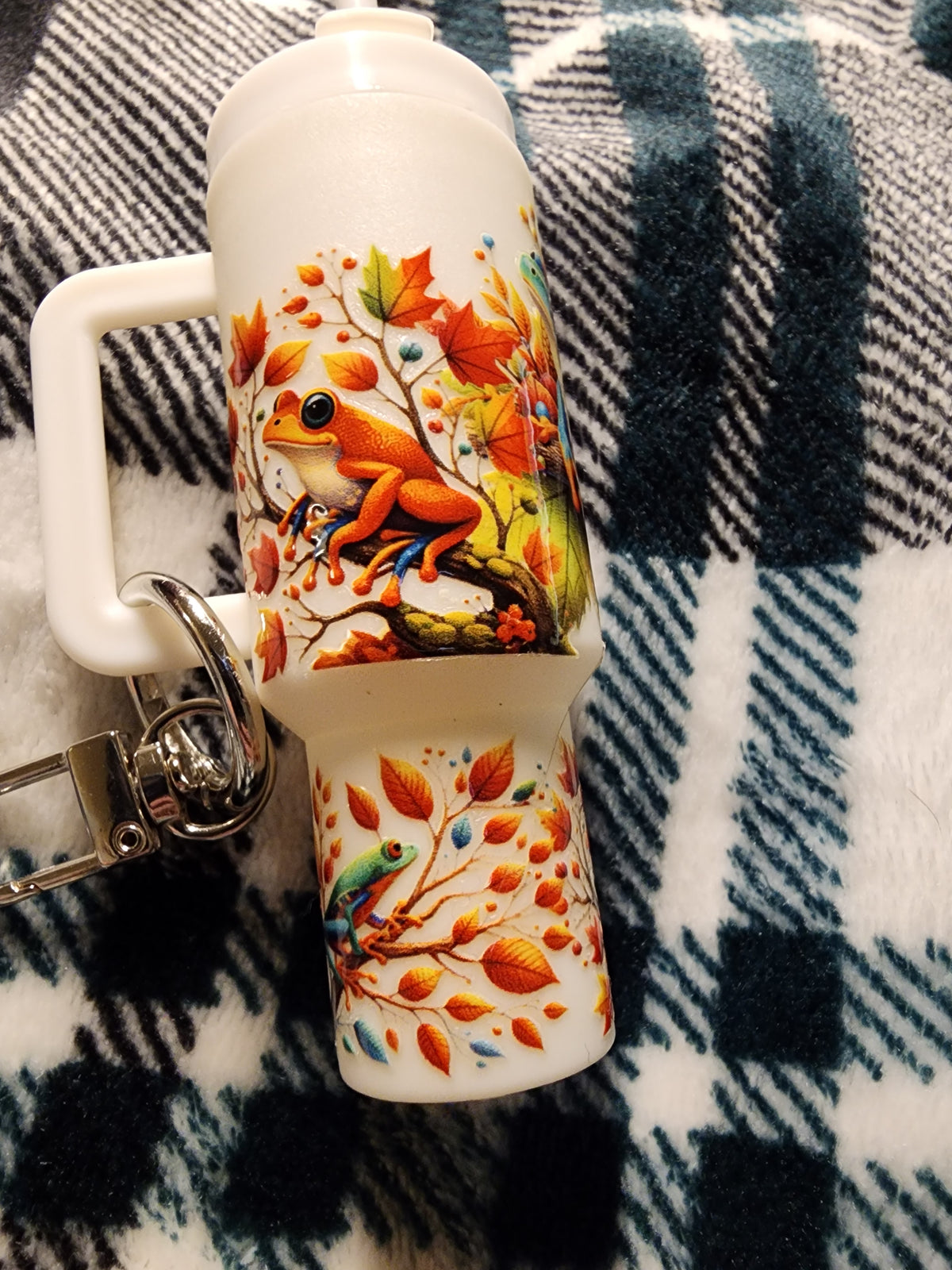 Multicolored frogs in a tree chapstick holder