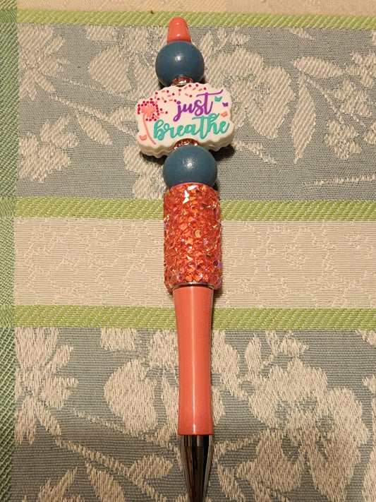 Just breathe orangish red pen