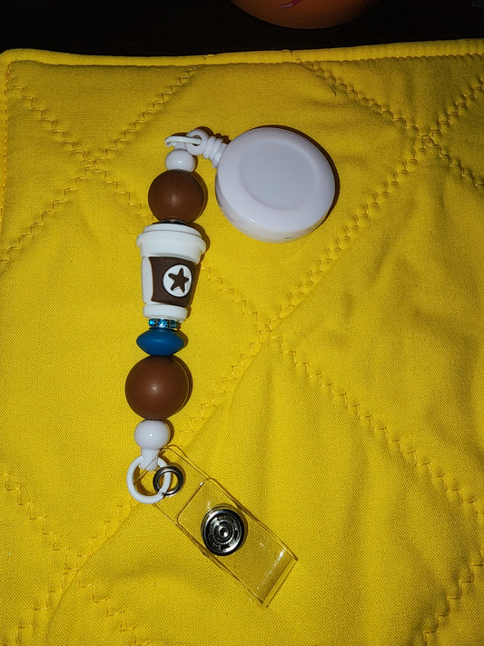 Coffee cup badge reel