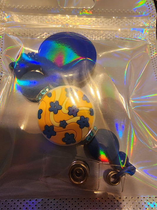 Yellow and blue badge reel