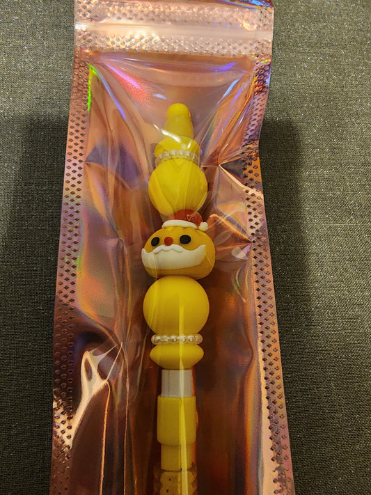 Yellow santa dumpling on a yellow pencil