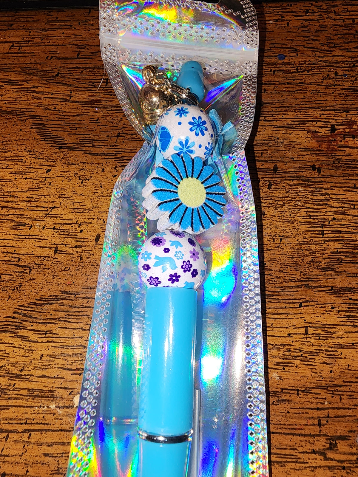 Blue and yellow daisy pen