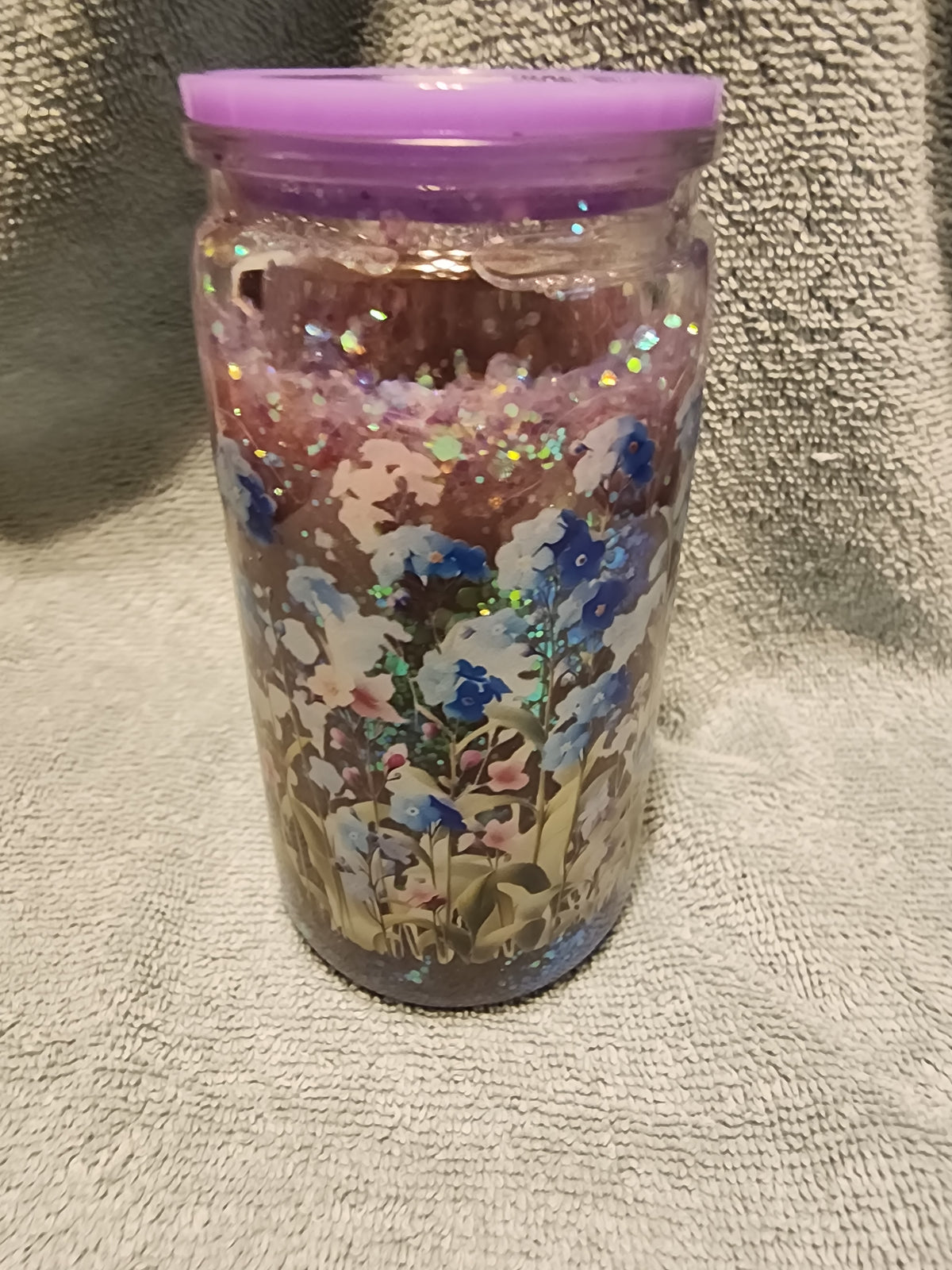Snow globe tumbler with blue and purple flowers