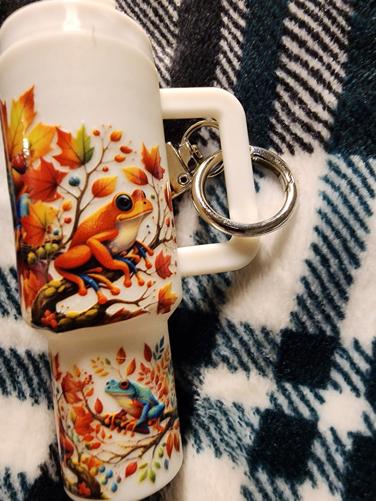 Multicolored frogs in a tree chapstick holder