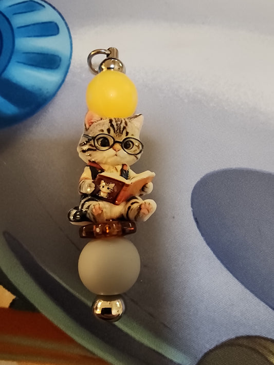 Cat reading a book keychain
