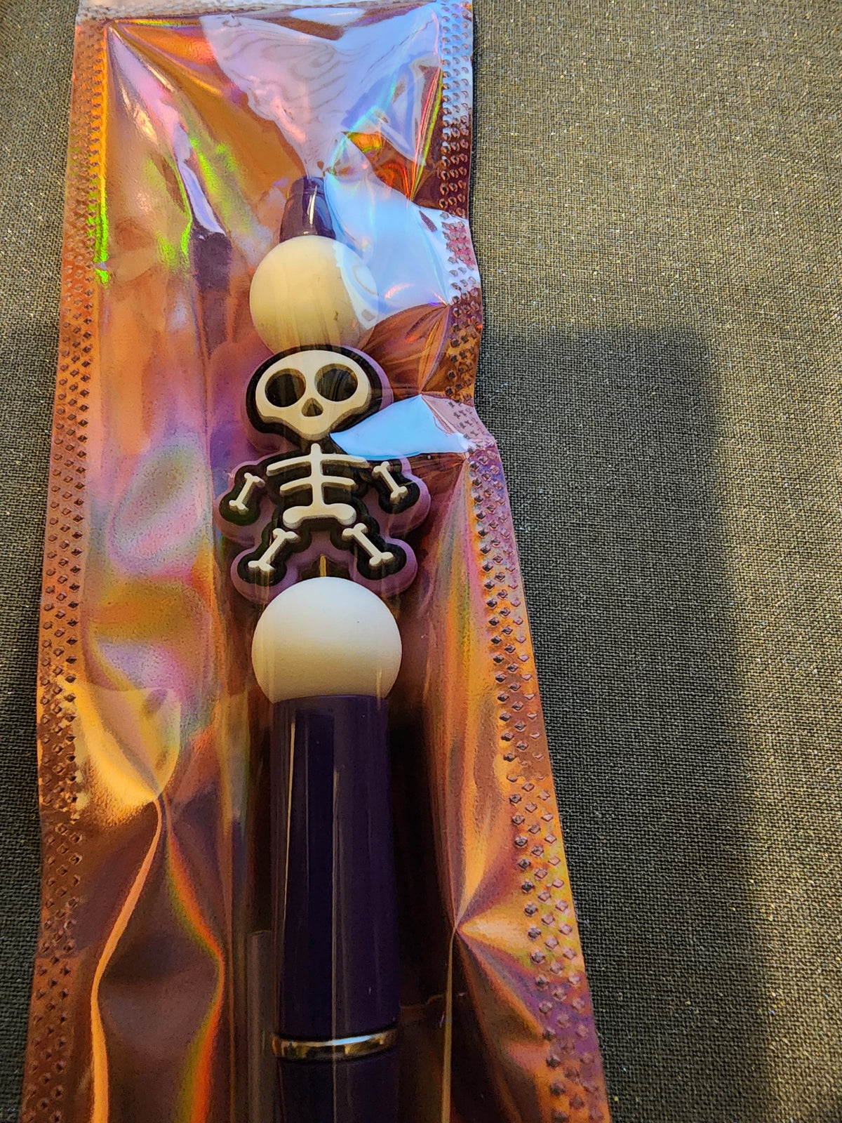 Skeleton purple pen