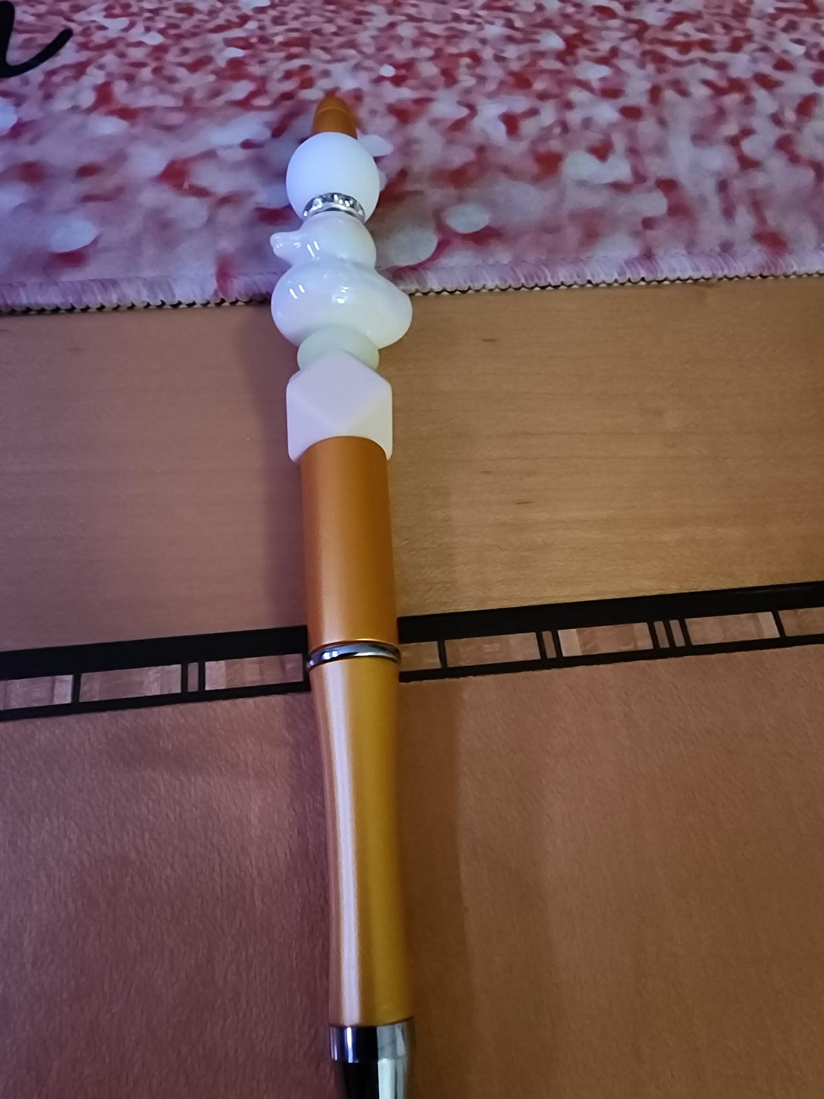 White rubber ducky 🦆 pen on a gold base