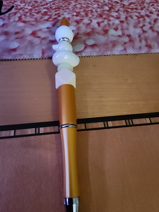White rubber ducky 🦆 pen on a gold base