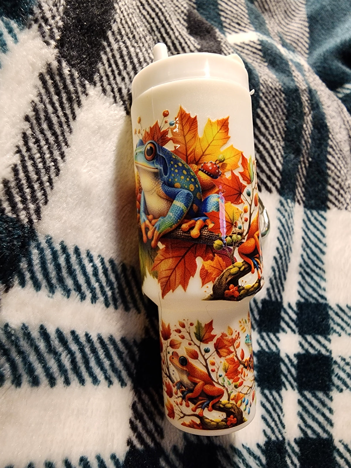 Multicolored frogs in a tree chapstick holder