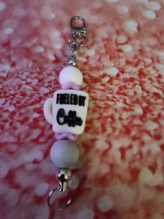 White purple and gray fueled by coffee keychain