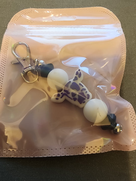 Purple and white cow keychain
