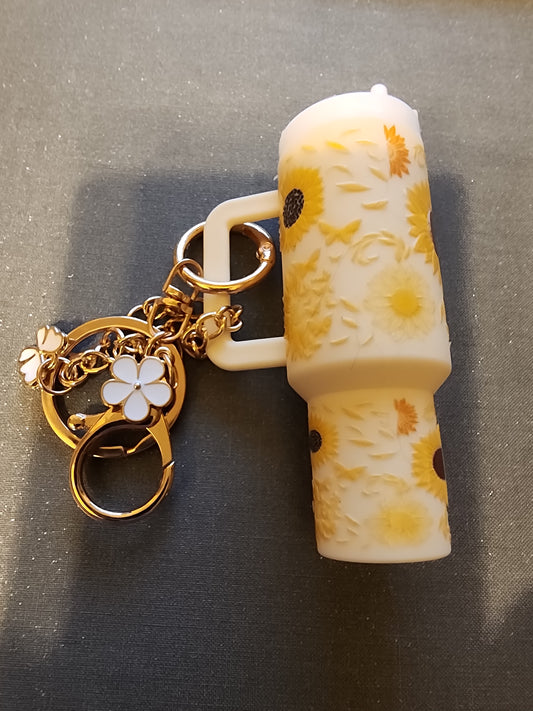 In a world of roses , be a sunflower 🌻  chapstick holder